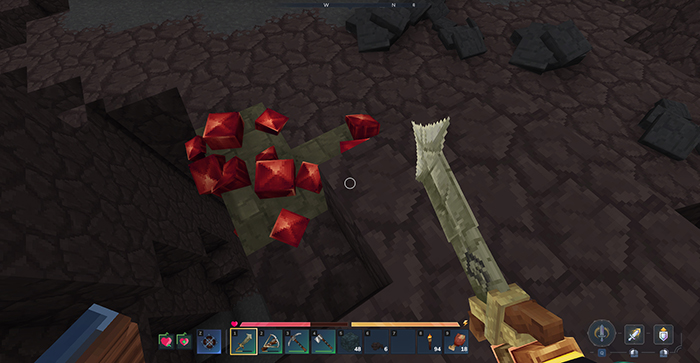Player mining red Adamantite ore in a dark underground cave with a pickaxe in Hytale.