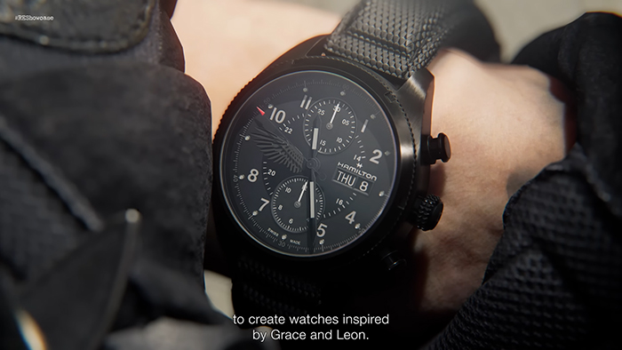A close-up of a Hamilton watch with a black dial and eagle emblem, inspired by Leon and Grace in Resident Evil Requiem.