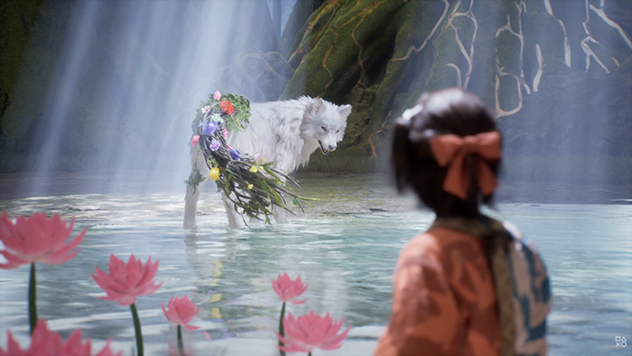 A white dog named Koo stands in shallow water. Emma watches from the shore in a serene forest setting with pink lotus flowers blooming around them.