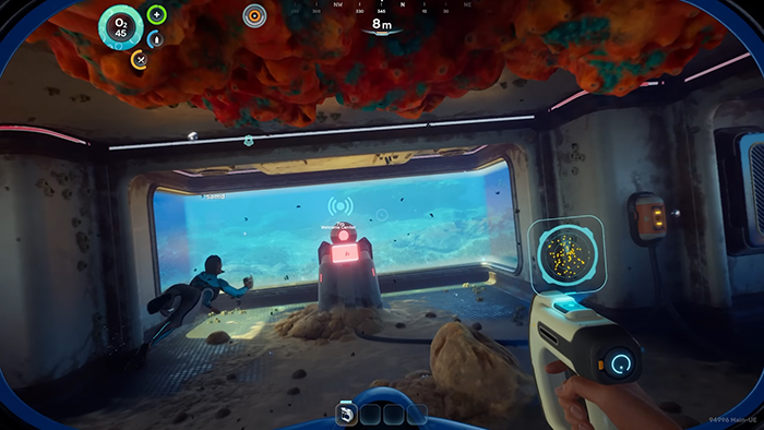 Player inside a base in Subnautica 2, viewing an alien structure through the window with a scanner in hand.