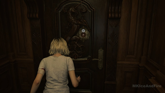 Grace using a key to unlock an ornate door with unicorn carving in Resident Evil Requiem