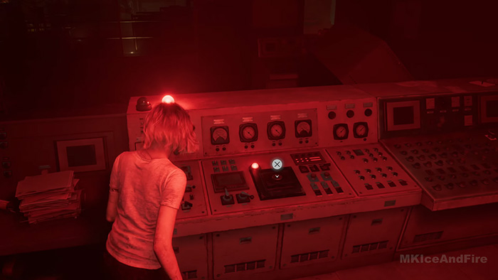 The character stands at the main console where red warning lights are illuminated, indicating the system is not yet activated.