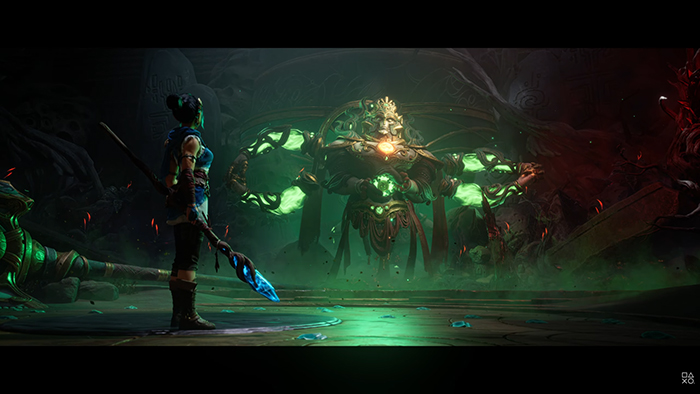 Kena stands ready with her staff, facing a massive, corrupted boss with glowing green eyes and tentacle-like arms in a dark temple. The floor is cracked, and faint blue light pulses from the ground.