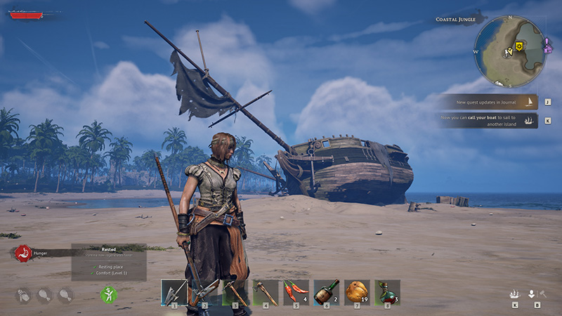 Beach scene in Windrose featuring a character standing before a large wrecked ship with a broken main sail and tilted hull. The background shows a tropical coastline under a blue sky. The bottom-left displays "Rested" status, and the top-right mini-map marks the location as "Coastal Jungle."