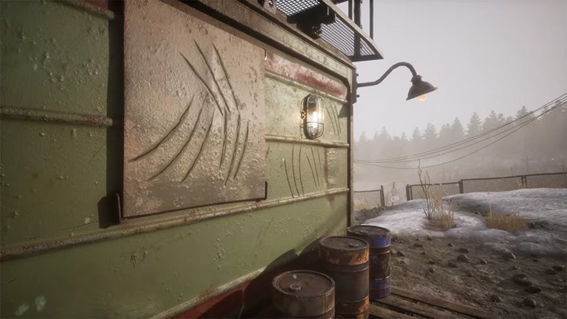 Weathered green train carriage with scratch marks and a dim lamp; rusted barrels foreground, foggy snow and poles behind, abandoned industrial frontier.