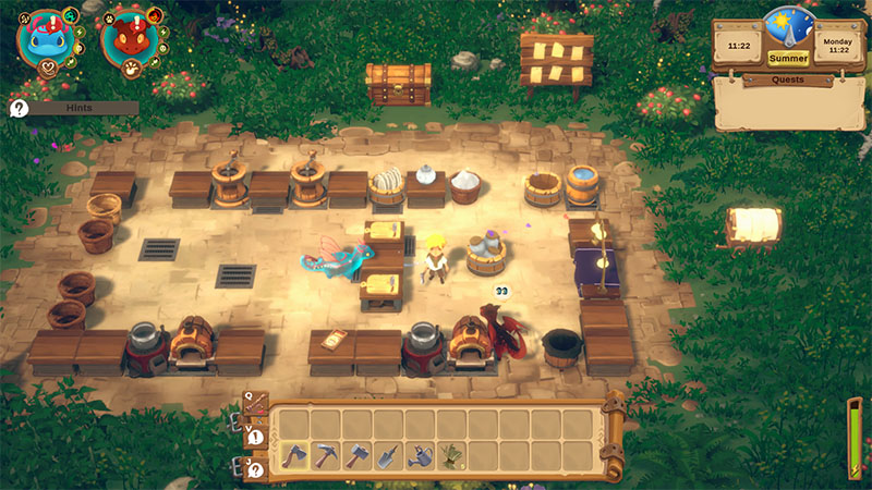 An outdoor crafting courtyard with stone flooring, where the player stands near a blue dragon and a red dragon. Multiple workstations—barrels, forges, cooking pots, and storage chests—are arranged around them; UI shows time (11:22), season, day, and inventory bar with tools.