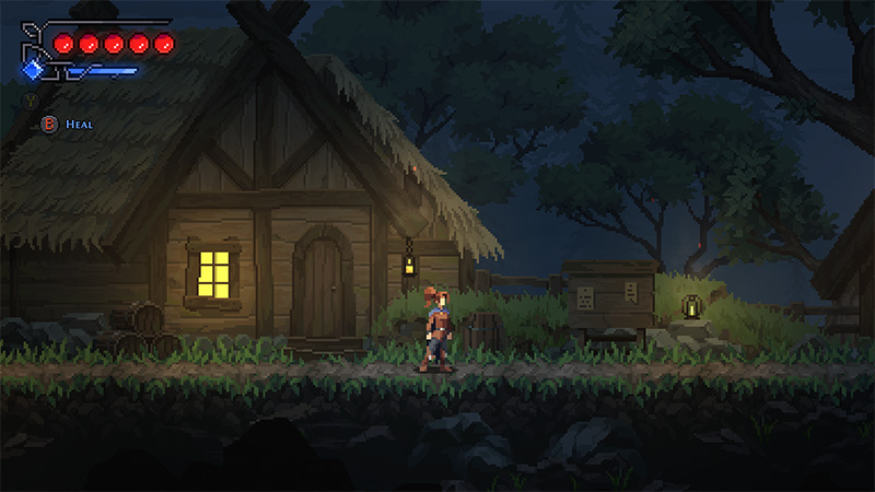 Fjor walks alone past a rustic wooden signpost beside the cottage at dusk; a lantern hangs nearby. Full health and stamina bars visible; “Heal” prompt active. Environment features detailed grass, rocks, and ambient forest lighting.