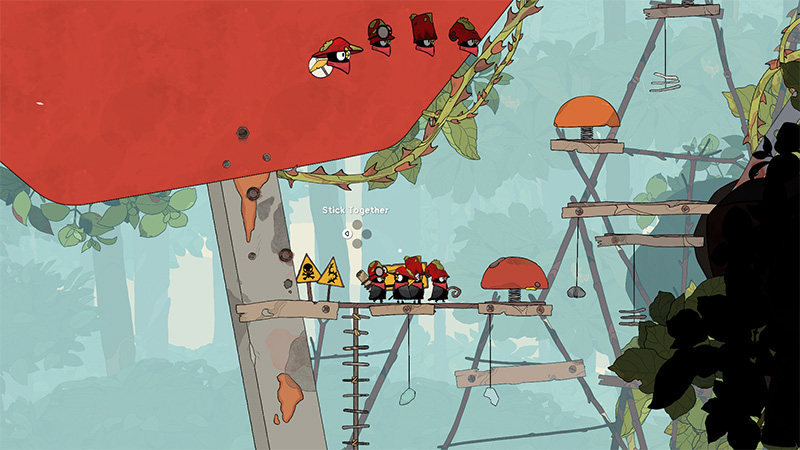 Four bird-like characters stand together on a narrow wooden plank suspended between structures, with the text “Stick Together” floating above them. Above the scene, three floating portrait icons (red-capped bird faces) appear beneath a large red canopy, likely indicating active companions or team members. Warning signs and vines frame the precarious path, suggesting cooperative puzzle-solving.