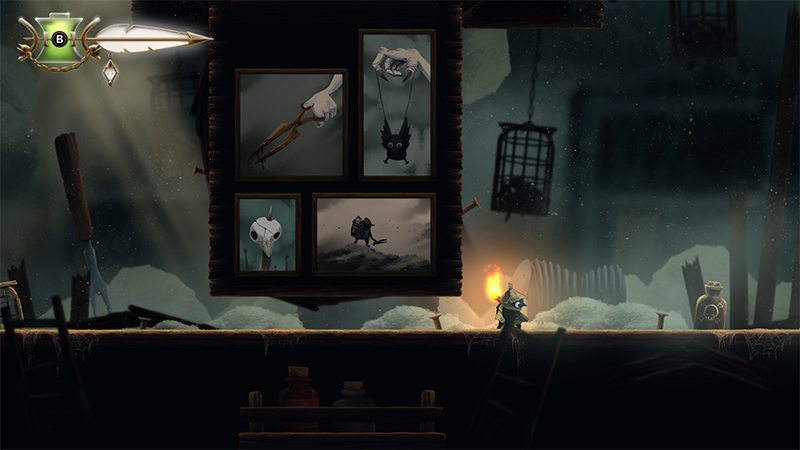 The character crouches beside a wooden display board holding four framed illustrations: a hand gripping pliers, a black bird suspended by strings, a skull with a feather, and a lone figure walking across a desolate landscape. Warm light from a nearby lantern casts long shadows in the dusty workshop.