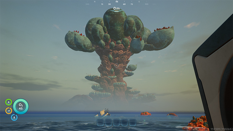 A towering alien organism rises from the ocean surface, its trunk thick and rocky, crowned with large bulbous green-blue pods and red-tipped tendrils; distant mountains fade into haze under a pale sky.