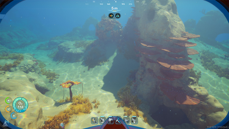 A narrow underwater passage winds between rock formations draped in layered orange fungal growths; a delicate umbrella-shaped creature drifts near the entrance, illuminated by dappled sunlight.