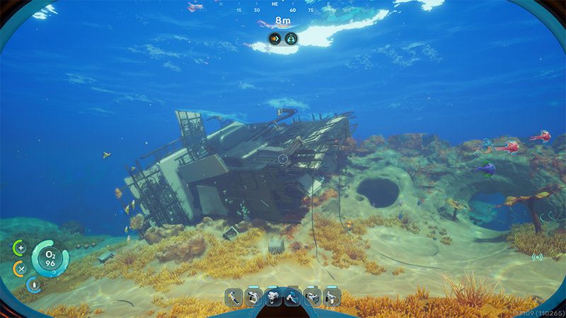 A damaged spacecraft lies tilted on a sandy seabed, its hull torn open and interior exposed; colorful fish swim among scattered debris and swaying kelp.
