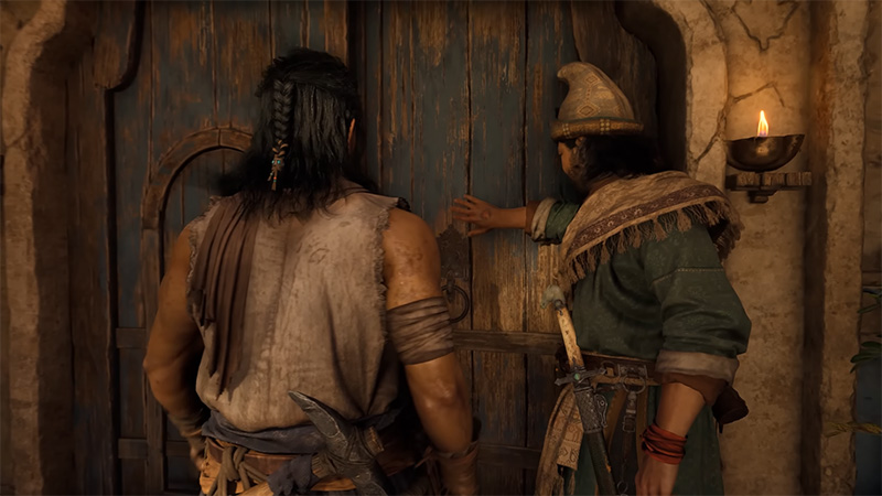 Two characters stand before an aged wooden door; the right one, wearing a pointed hat, reaches to open it, while the left one—long braided hair, armed with a knife—waits. A lit oil lamp hangs on the stone wall.