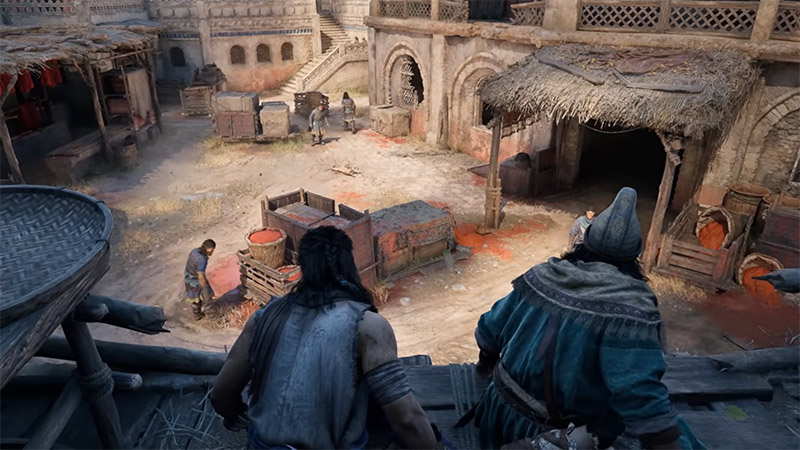 High-angle view of a Middle Eastern–style marketplace: the protagonist and companion crouch on a rooftop edge, surveying below—workers dye fabric, blood-stained crates, thatched shelters, and stone buildings fill the scene.