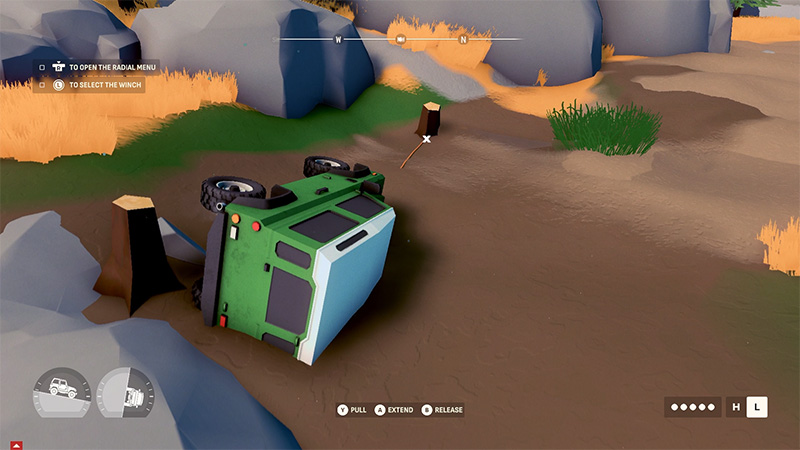 A green off-road vehicle lies overturned on its side in sandy terrain, with a winch cable attached to a tree stump—players are using the winch to recover it.
