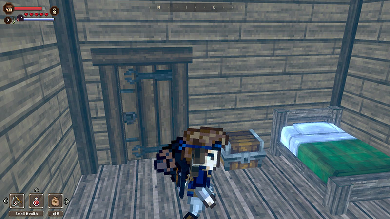 Bob stands inside a wooden cabin containing a bed, a chest, and a wooden door.