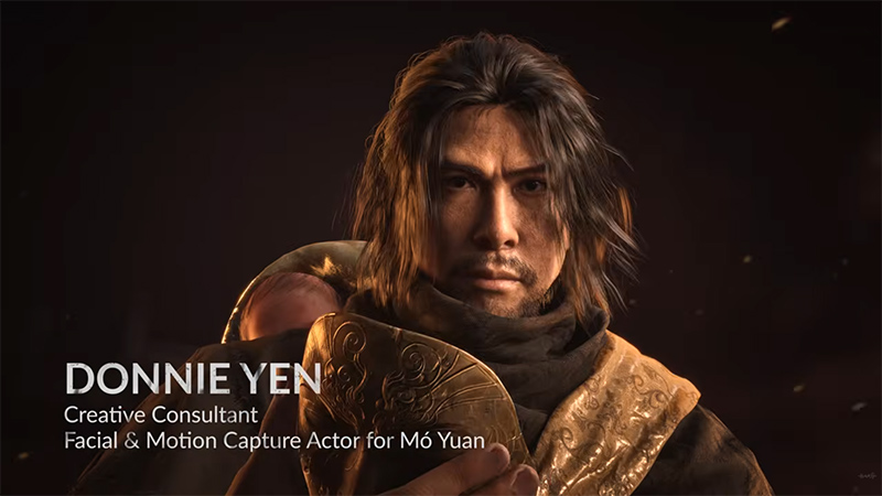 Donnie Yen, Creative Consultant and Facial & Motion Capture Actor for the character Mó Yuán in the game Phantom Blade Zero, depicted in historical-style attire holding a mask, with a resolute expression.