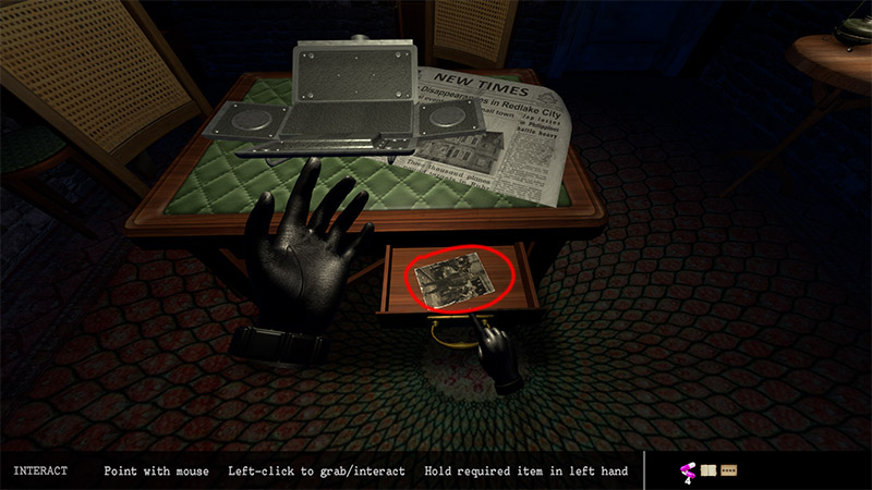 Another clue photo can be found in the drawer of the table with the lockbox.